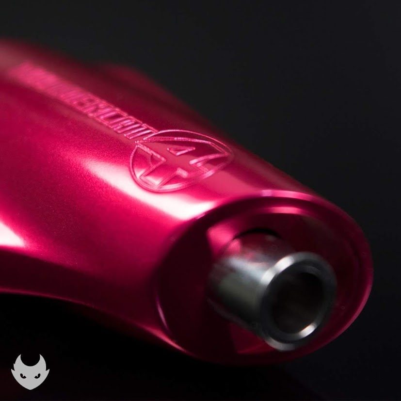Macro of a magenta grip tip, knurled, with a threaded collar