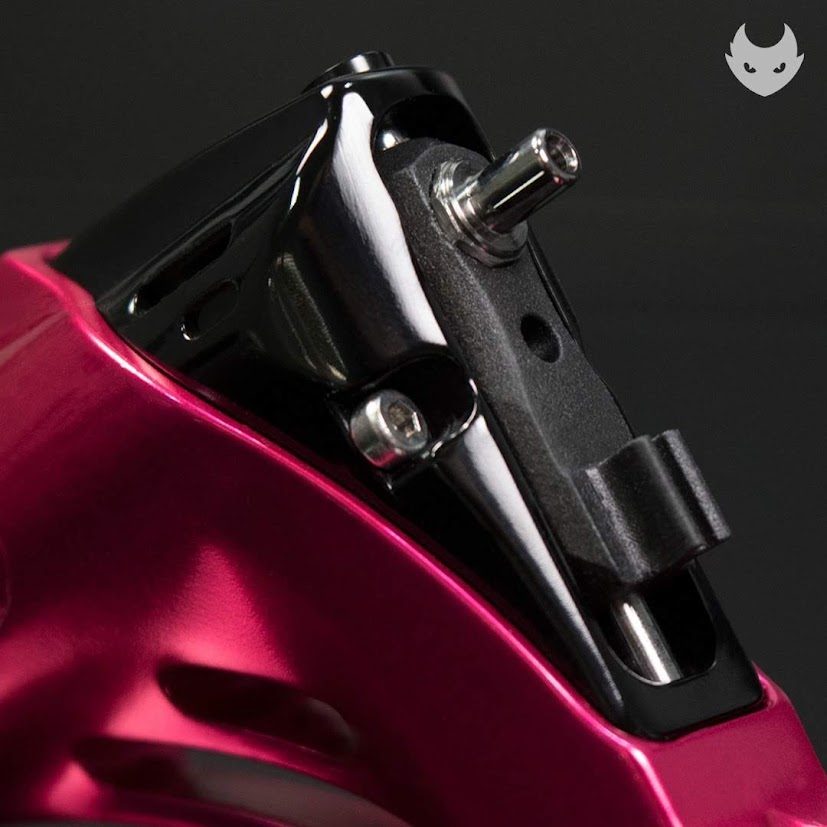 Armature yoke and clip-cord post on the magenta rotary, black hardware