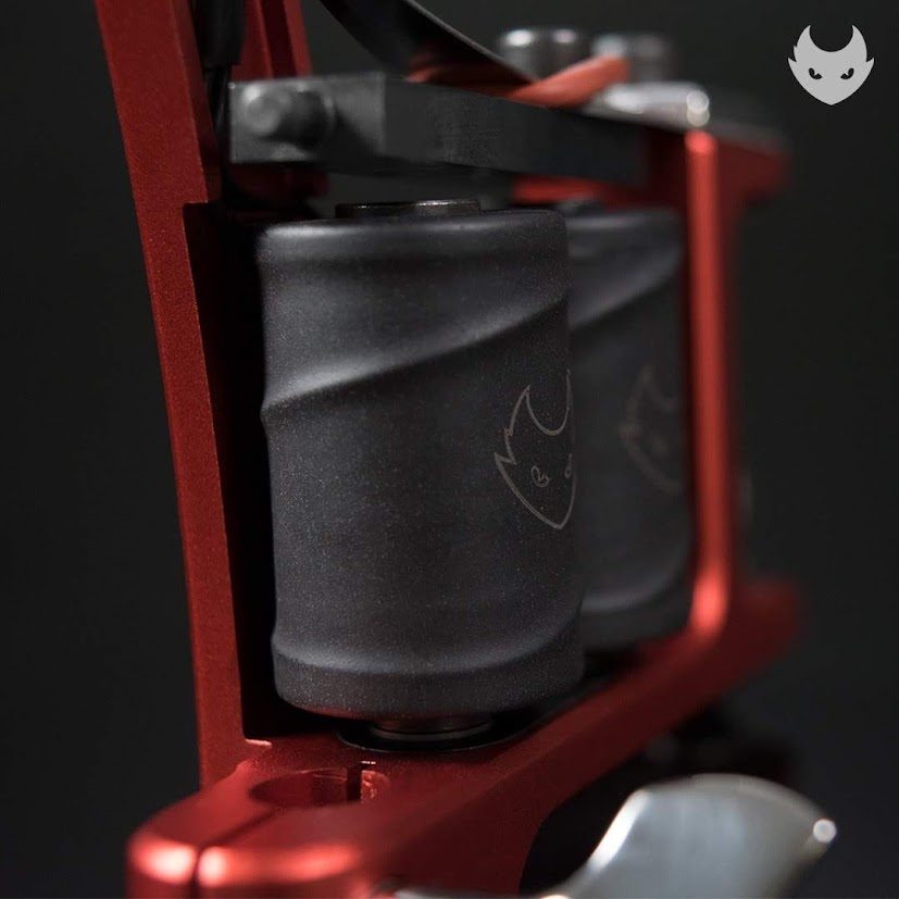 Twin wrapped coils in matte black with the house mark etched, red frame
