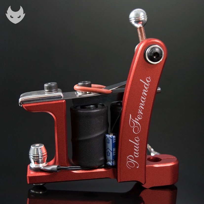 Red anodized dual-coil liner machine, classic frame, artist name engraved on the spring deck