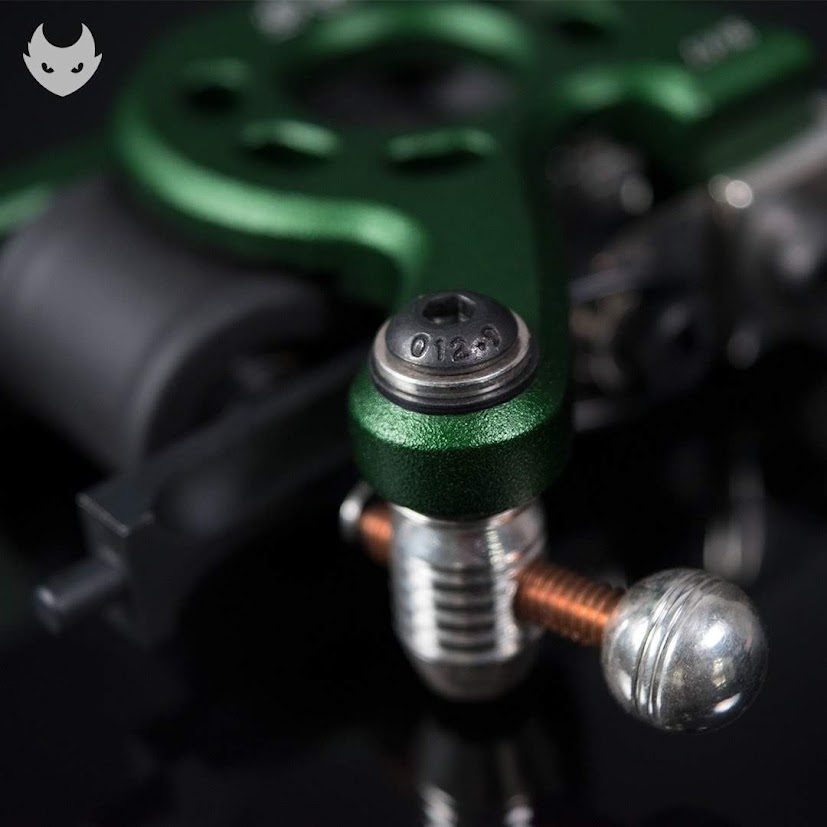 Chrome ball adjuster and copper spring on a red machine with a cursive engraved name