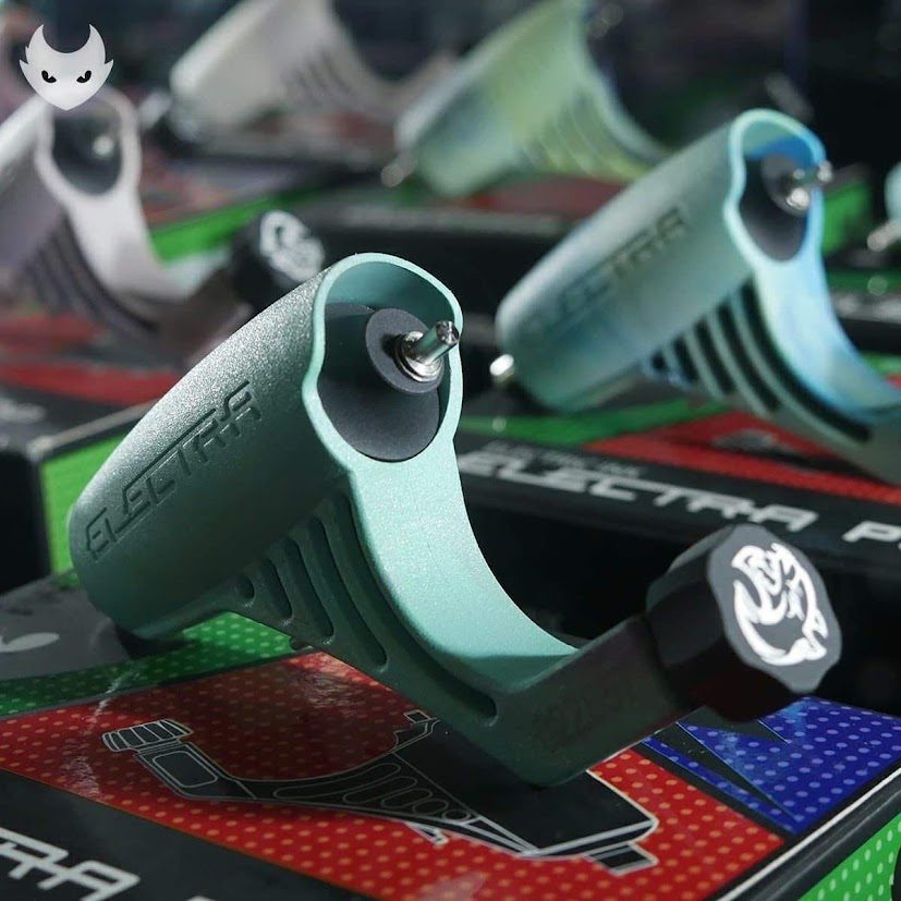 Sage-green Electra grips resting on their printed retail boxes